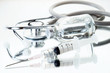 Medical ampoules, syringe and stethoscope