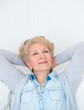 Smiling happy senior woman relaxing at home