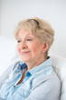 Senior woman portrait, at home with white hair