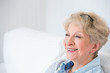 Senior woman portrait, at home with white hair
