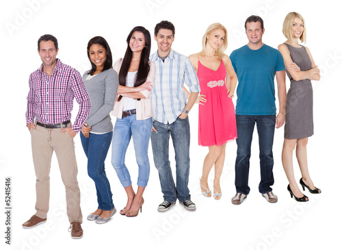 Photo: Casual group of people standing over white Casual group of people standing over white