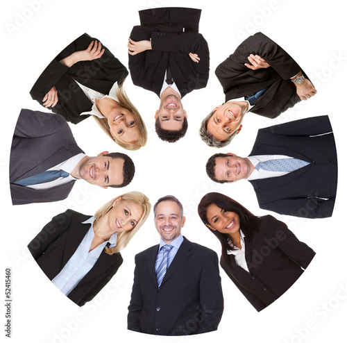 Photo: Low angle view of diverse group of business people Low angle view of diverse group of business people