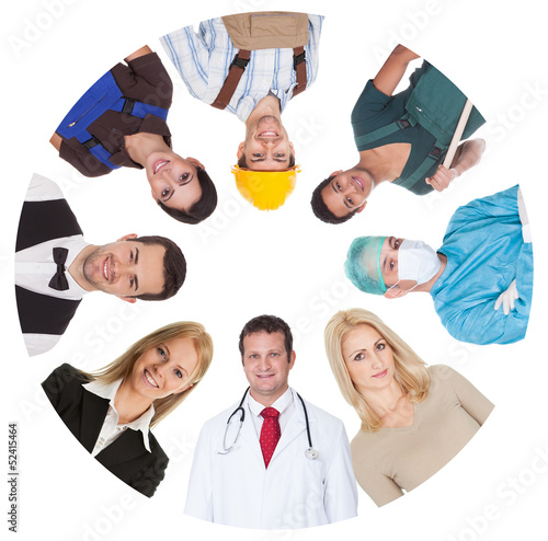 Photo: Low angle view of diverse professional group Low angle view of diverse professional group