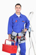 Skillful electrician with equipment on white background
