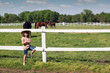 beautiful little girl with cowboy hat on ranch