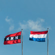 Photo: The Dutch national flag and the official flag of Amsterdam The Dutch national flag and the official flag of Amsterdam