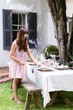 Party planner setting the table for the gathering