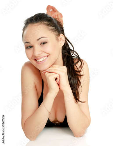 Photo: A beautiful smiling woman in a white swimsuit A beautiful smiling woman in a white swimsuit