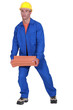 Photo: A roofer carrying tiles roof. A roofer carrying tiles roof.