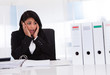 Shocked Businesswoman Looking At Folder