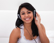 Woman Listening To Music On Headphones