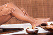 Photo: Young Woman Applying Oil Her Legs Young Woman Applying Oil Her Legs