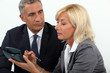 Photo: Senior business couple going over finances Senior business couple going over finances
