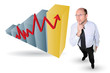 Thoughtful businessman next to a graph