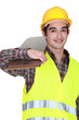 craftsman holding floor tiles