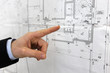 Architect pointing to floor plans