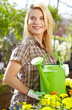 Female florist or gardener in flower shop or nursery
