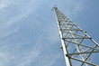 Steel cell phone tower against a blue sky 
