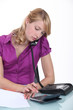 Foto: secretary on the phone in office secretary on the phone in office