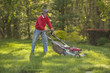Man mowing the grass in his yard