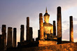 Ancient buddha statue at twilight, Wat Mahathat in Sukhothai His