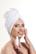 Photo: woman with cosmetics product woman with cosmetics product