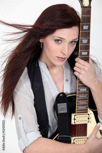Photo: Woman with an electric guitar Woman with an electric guitar