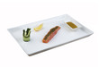Raw salmon fillet with spices on plate