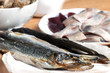 Photo: Assorted fish on wooden table Assorted fish on wooden table