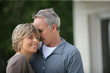 Foto: Married couple stood outside their house Married couple stood outside their house