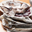 Photo: Seafood theme. Macro photo of assorted fish on wooden table Seafood theme. Macro photo of assorted fish on wooden table