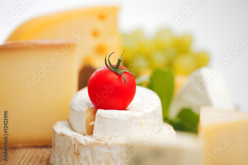 Photo: cheese on a wooden table cheese on a wooden table