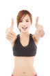 happy young fitness woman with thumbs up