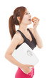 Beautiful young healthy woman eating apple