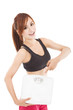 young woman holding weight scale and finger pointing it