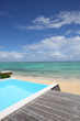 Beautiful view of infinity pool with wooden deck