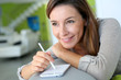 Woman at home relaxing and using smartphone