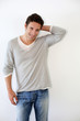 Handsome guy standing on white background
