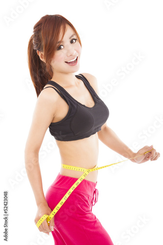 Photo: Young beautiful woman with measure tape Young beautiful woman with measure tape