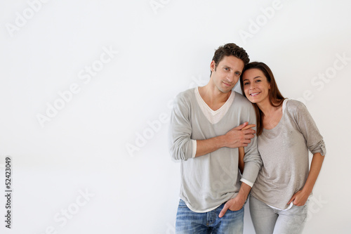 Photo: Couple standing on white background Couple standing on white background