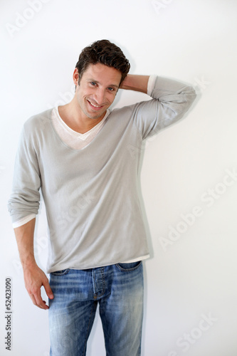 Photo: Handsome guy standing on white background Handsome guy standing on white background