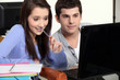 Photo: Two students sat studying together Two students sat studying together