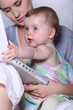 Mother and baby with a laptop
