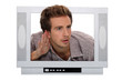 young man through a TV screen listening something carefully