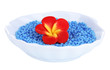 Colorful beads with handmade flower in plate isolated on white