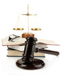 Golden scales of justice, gavel and books isolated on white