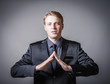 man holds his hands folded