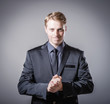 man holds his hands folded
