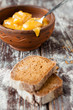 honey in a bowl and pieces of rye bread