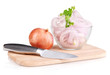 Onion cut with rings in bowl on wooden board isolated on white